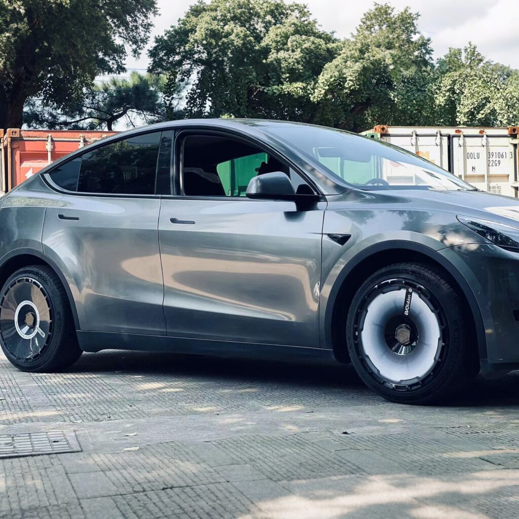Custom Tesla wheel covers fitted on a Model Y after a fresh wash