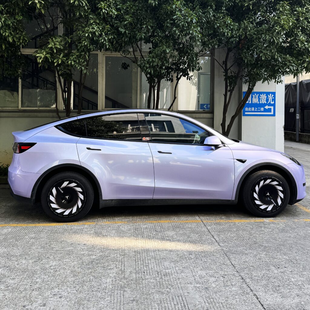 Custom Tesla wheel covers installed on a Model Y, showing aftermarket price tiers