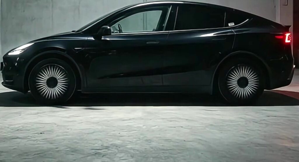 Black Tesla Model Y with black and white turbine wheel covers that protect resale value